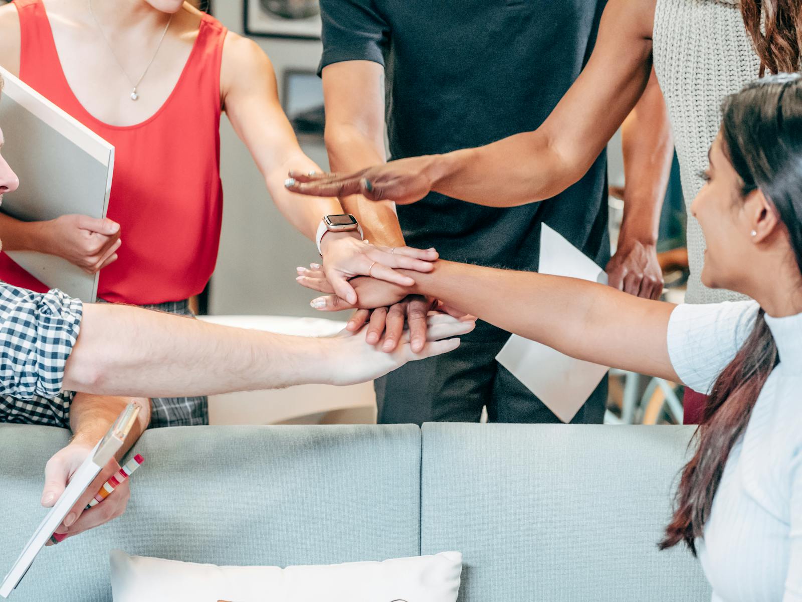 Group of People Putting Their Hands Together